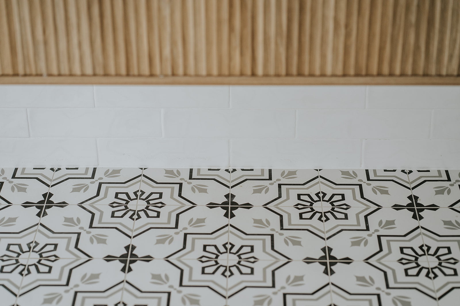 Timber vanity and encaustic floor tiles