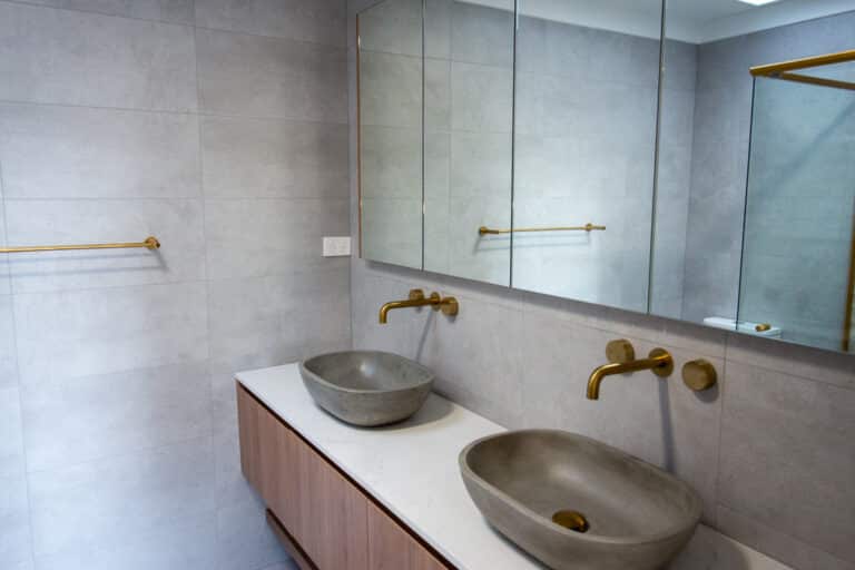 Modern bathroom renovation with concrete basins